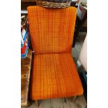 A retro acid orange tapestry upholstered boudoir chair, set on moulded splayed legs