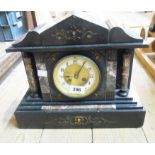 A late Victorian black slate and marble cased mantel clock of architectural design with Richard et