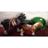 Two model carthorse figurines - sold with two enamel chambersticks