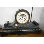 A late Victorian black slate and marble cased drum and scroll mantel clock with visible escapement