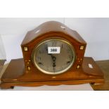 A vintage inlaid mahogany cased mantel clock with eight day chiming movement