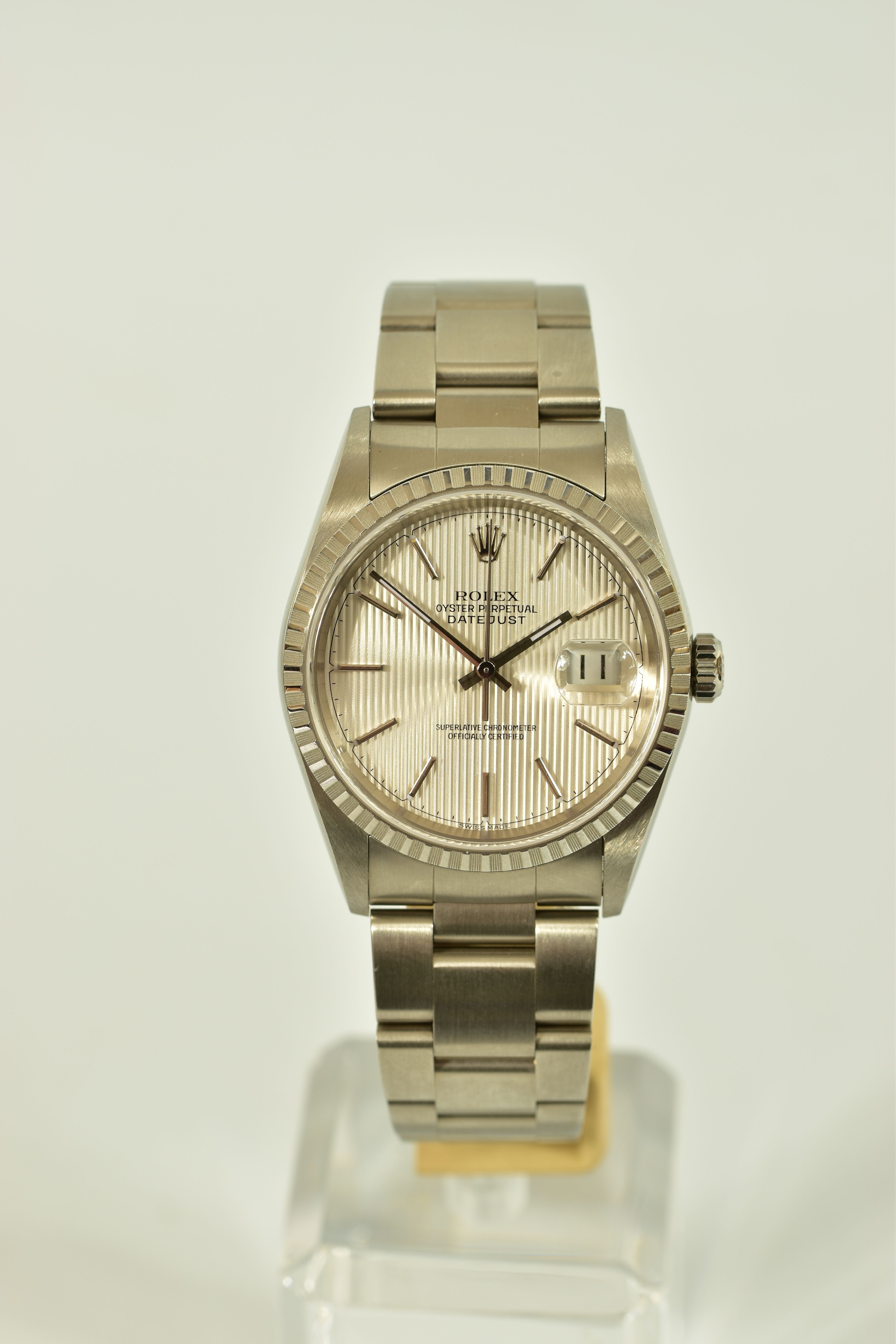 A ROLEX OYSTER PERPETUAL DATEJUST WRISTWATCH, model 16620, silver coloured stripped dial, baton