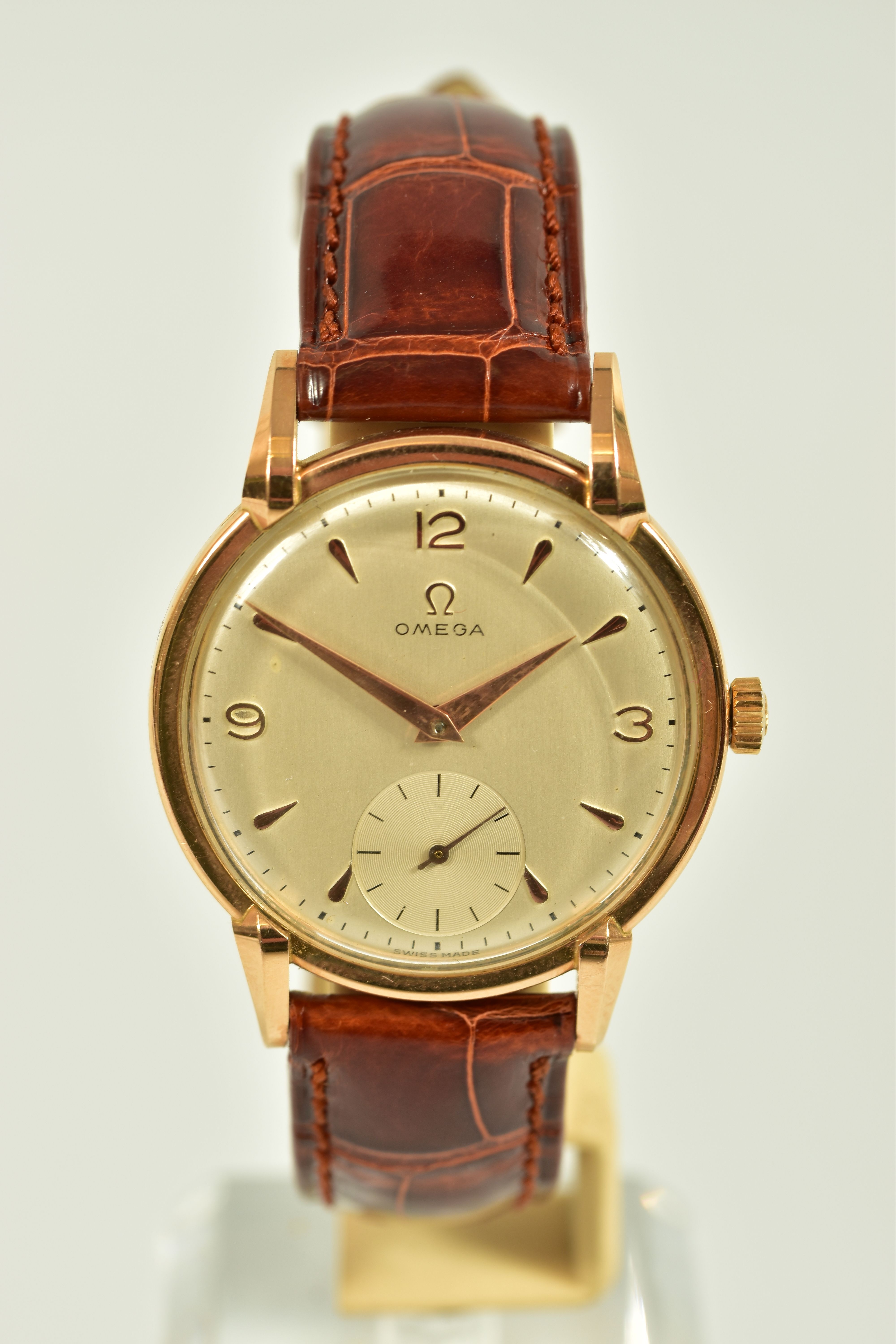 AN 18CT GOLD OMEGA WRISTWATCH, silvered dial with mixed hour markers, subsidiary dial at six o'