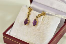 A PAIR OF 9CT GOLD AMETHYST AND SEED PEARL DROP EARRINGS, each suspending a claw set, oval cut