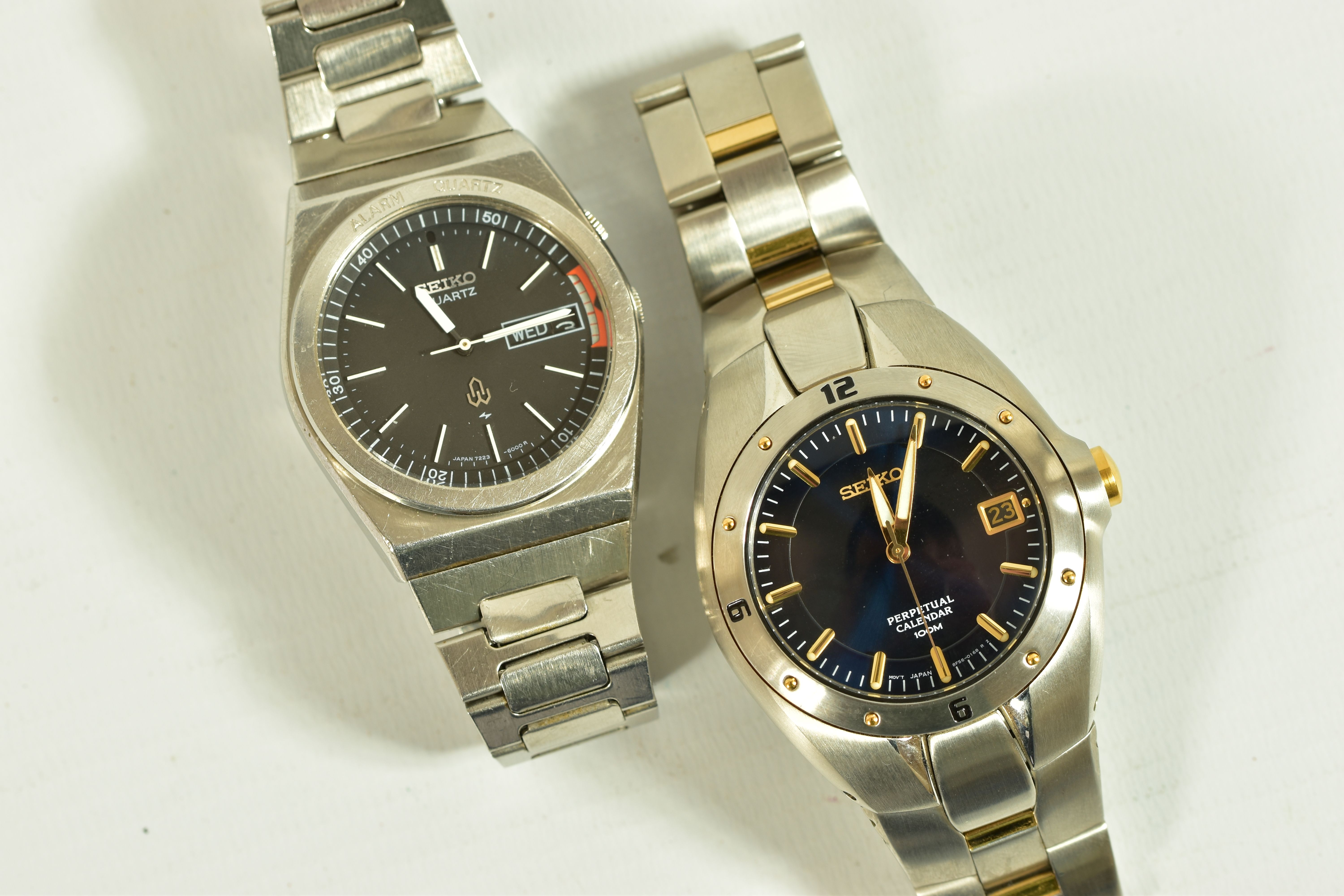 TWO SEIKO WRISTWATCHES, the first a Seiko perpetual calendar watch, dark blue dial with gold