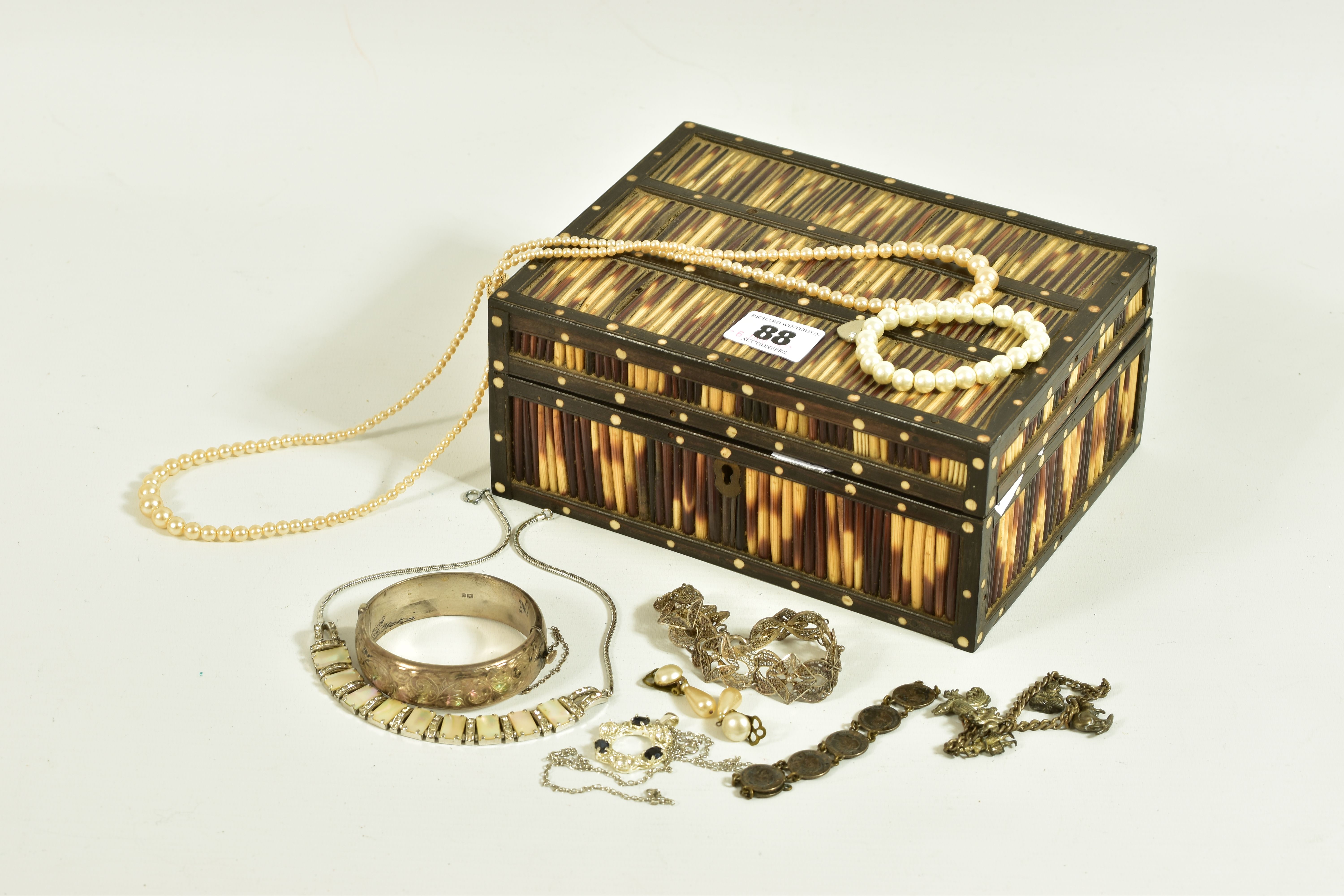 A WOODEN BOX WITH CONTENTS OF SILVER AND COSTUME JEWELLERY, an AF wooden box with reed detailed