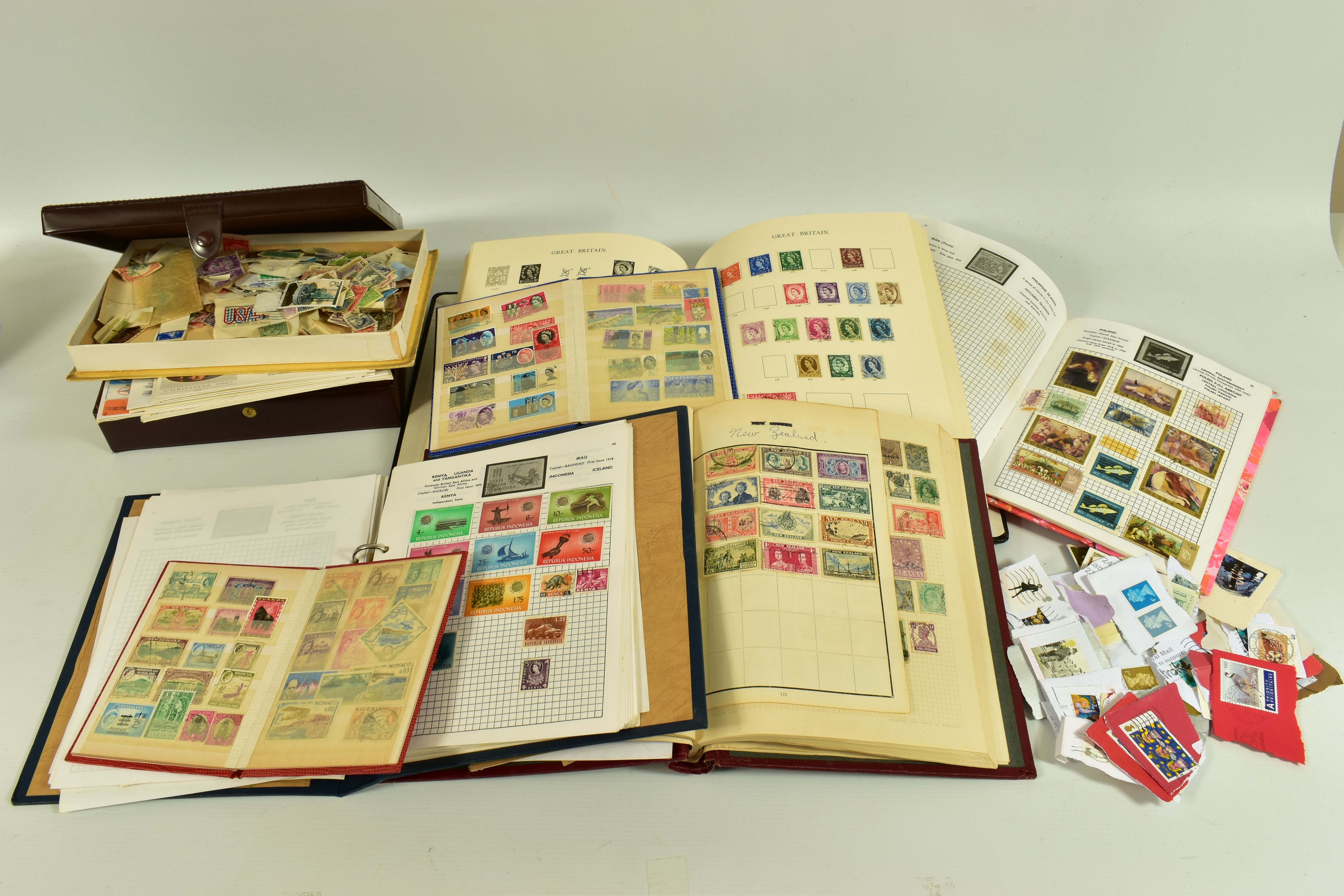 A RANGE OF FIRST DAY COVERS AND WORLDWIDE STAMPS, across a number of albums and loose in tins, the