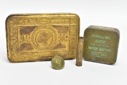 A WORLD WAR ONE PRINCESS MARY TIN, containing a smaller possibly WW2 era tin containing a bottle