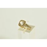 A 9CT GOLD CUBIC ZIRCONIA SET RING, designed with a central four claw set, circular cut,