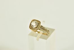 A 9CT GOLD CUBIC ZIRCONIA SET RING, designed with a central four claw set, circular cut,