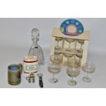 A THOMAS WEBB TRICORN SHAPE CUT GLASS DECANTER AND STOPPER, a boxed set of six 1970s Babycham