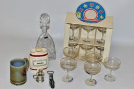 A THOMAS WEBB TRICORN SHAPE CUT GLASS DECANTER AND STOPPER, a boxed set of six 1970s Babycham