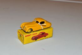 A BOXED DINKY TOYS JAGUAR XK120 SALOON, No.157, yellow body with lighter yellow hubs, lightly