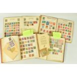 FOUR ALBUMS OF WORLDWIDE STAMPS, including two well filled albums with some interest in German