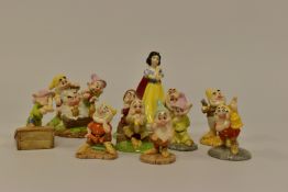 ELEVEN BOXED ROYAL DOULTON WALT DISNEYS CLASSIC SNOW WHITE AND THE SEVEN DWARFS FIGURES,