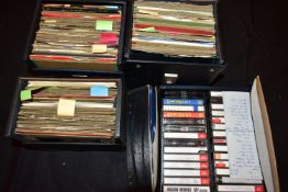 FOUR CASES CONTAINING APPROX ONE HUNDRED AND TWENTY 7in SINGLES AND CASSETTE TAPES from artists