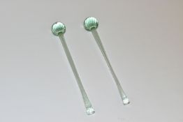 A NEAR PAIR OF NAILSEA GLASS DRUM STICKS, with wrythen twist design, longest length 33cm (2) (