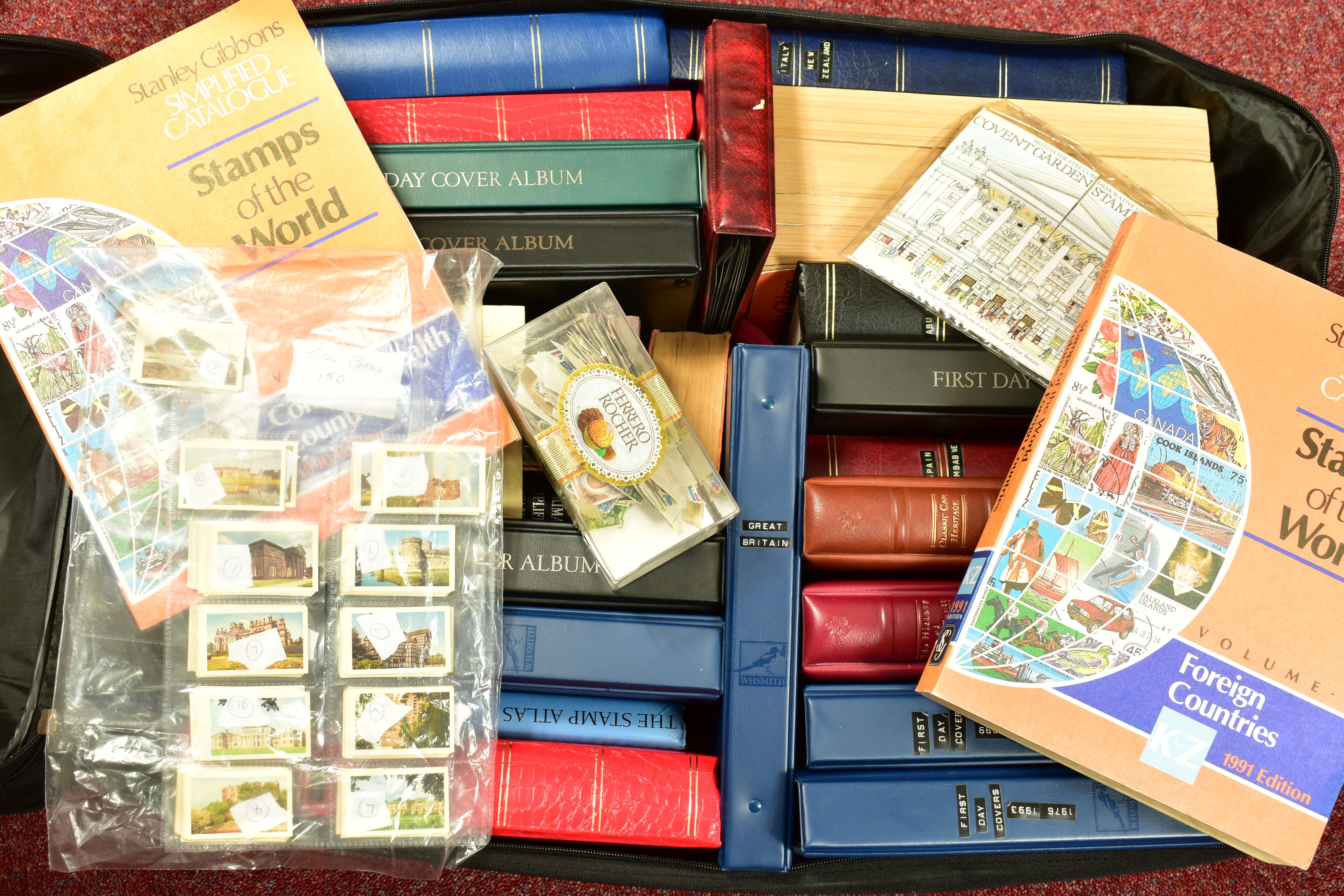 STAMPS, a large and very heavy suitcase with worldwide collection of stamps in eighteen albums