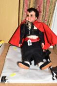 AN UNMARKED COMPOSITION DOLL DRESSED AS A MATADOR, moulded and painted features and hair, jointed