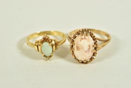 TWO RINGS, the first designed as an oval opal cabochon with colourless gem triple clusters to the