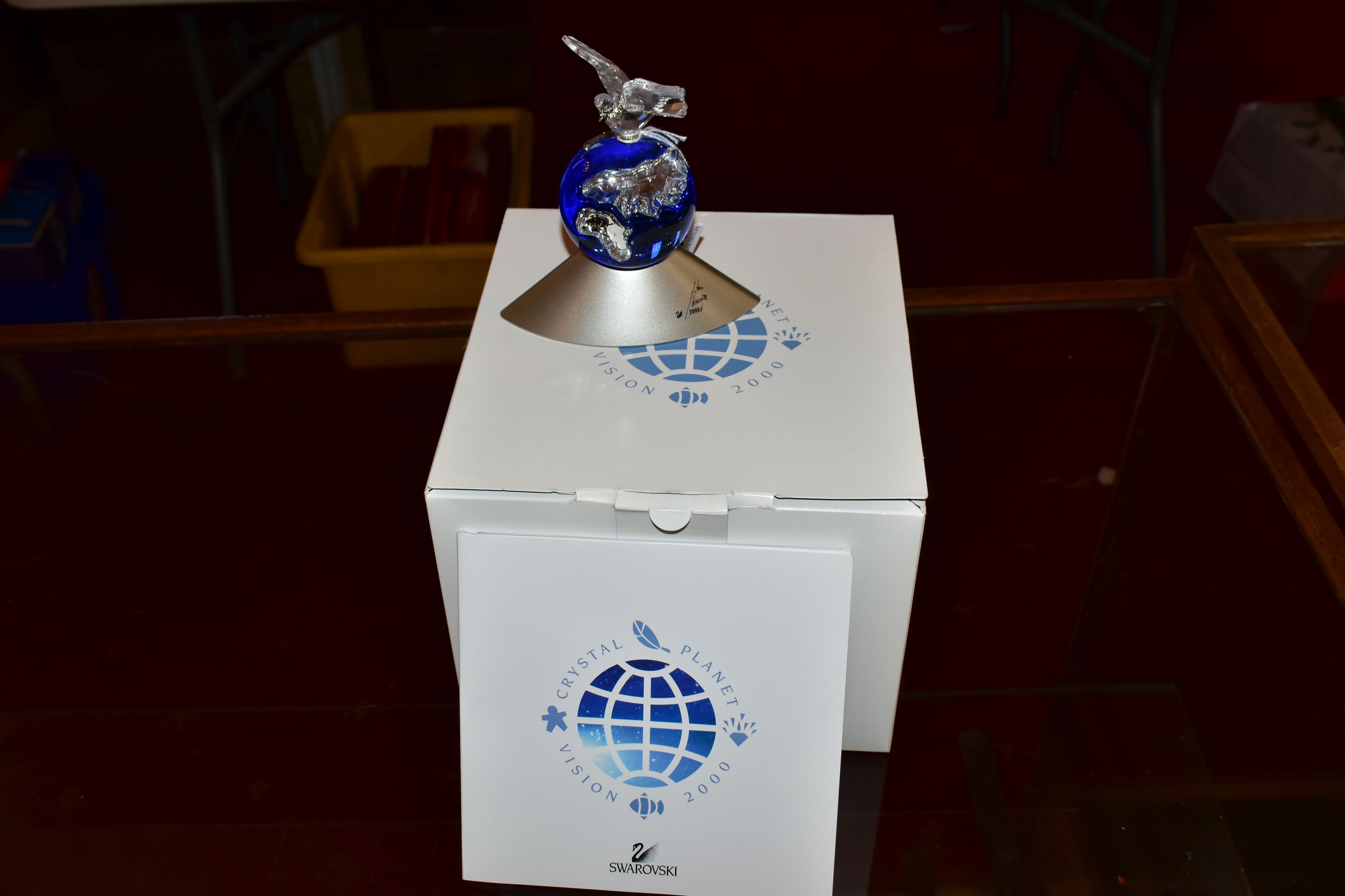 A BOXED SWAROVSKI CRYSTAL PLANET VISION 2000, designed by Anton Hirzinger, height 12cm, with