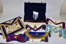 MASONIC INTEREST, a leather case containing five Masonic aprons, a Masonic sash and book of