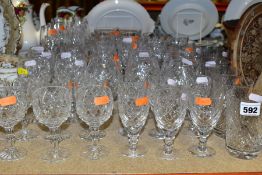 A GROUP OF CUT CRYSTAL DRINKING GLASSES, comprising approximately forty eight glasses in eight sets,