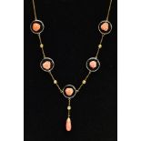 A YELLOW METAL ONYX AND CORAL NECKLACE, designed with five circular onyx disks, each set with a