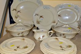 AN EIGHTEEN PIECE ALFRED MEAKIN WILDFOWL PART DINNER SERVICE, decorated with scenes of flying ducks,