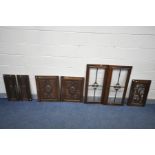 THREE PAIRS OF CARVED OAK CUPBOARD DOORS, including glazed doors, geometric doors, etc, largest