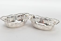 TWO SILVER BONBON DISHES, each of an oval pierced from, wavy rims, hallmarked 'William Comyns & Sons