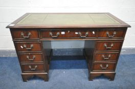 A MAHOGANY TWIN PEDESTAL DESK, with a green leather skiver, over nine drawers, width 122cm x depth