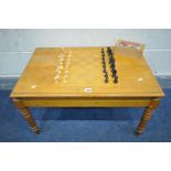 AN OAK CHESS COFFEE TABLE, width 76cm x depth 49cm x height 45cm, with a box of chess pieces