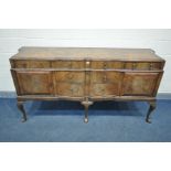 A MID TO LATE 20TH CENTURY WALNUT AND CROSSBANDED QUEEN ANNE SIDEBOARD, with a shaped top, two short