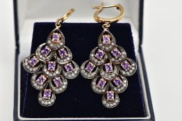 A PAIR OF SILVER GILT AMETHYST DROP EARRINGS, each drop of an openwork diamond shape, set with