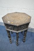 AN ANGLO-INDIAN STAINED WOOD OCTAGONAL OCCASIONAL TABLE, with carved abundant decor, including