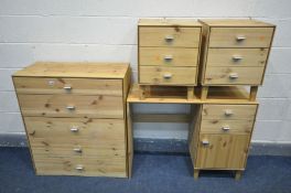A PINE FOUR PIECE BEDROOM SUITE, comprising a chest of five drawers, dressing table and a pair of