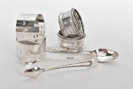 FOUR SILVER NAPKIN RINGS, A PAIR OF SUGAR TONGS AND A TEASPOON, two napkin rings engraved with