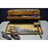 A VINTAGE WOODEN TOOLBOX containing a selection of woodworking tools chisels, hammer, planes etc