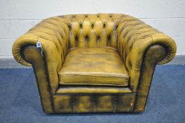 A YELLOW LEATHER CHESTERFIELD CLUB CHAIR, width 110cm x depth 93cm x height 72cm