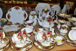 A SIXTY ONE PIECE ROYAL ALBERT OLD COUNTRY ROSES TEA SET, comprising a coffee pot, a teapot (chip