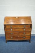 A GEORGIAN MAHOGANY BUREAU, the fall front enclosing a fitted interior, above four drawers, on