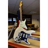 TWO STRAT TYPE ELECTRIC GUITARS one by Samick in Ivory with a black scratchplate, white pickups