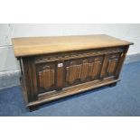 AN OAK LINENFOLD BLANKET BOX, width 96cm x depth 38cm x height 48cm