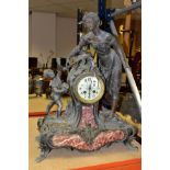 A SPELTER AND VARIGATED MARBLE DRUM HEAD MANTLE CLOCK, the Uranium glass dial having Arabic