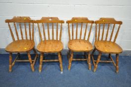 A SET OF FOUR PINE DINING CHAIRS