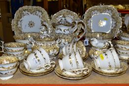 A THIRTY NINE PIECE NINETEENTH CENTURY COALPORT TEA SET, in white, pale apricot and gold, with a