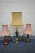 A BRASS TABLE LAMP, with a fabric shade, height to fitting 61cm, another brass lamp and a ceramic