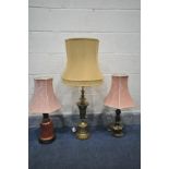 A BRASS TABLE LAMP, with a fabric shade, height to fitting 61cm, another brass lamp and a ceramic