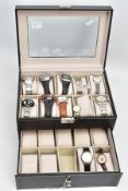 A WATCH DISPLAY CASE WITH ASSORTED WATCHES, a black watch case with twelve assorted watches